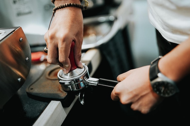 Photo midsection of man holding preparing coffee