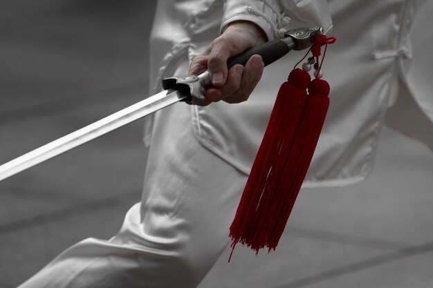 Photo midsection of man holding sword