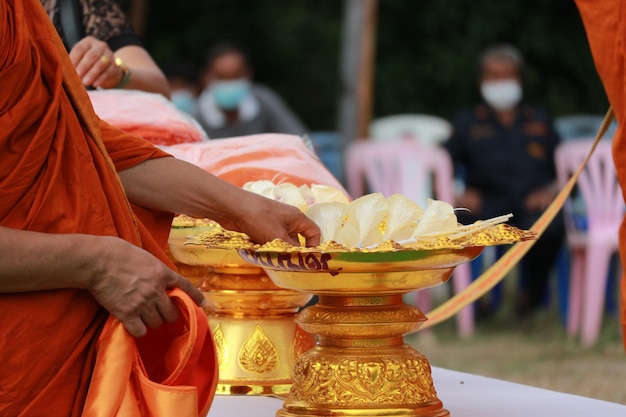 Midsection of man holding temple in market