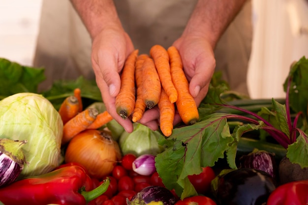 Photo midsection of man holding vegetables