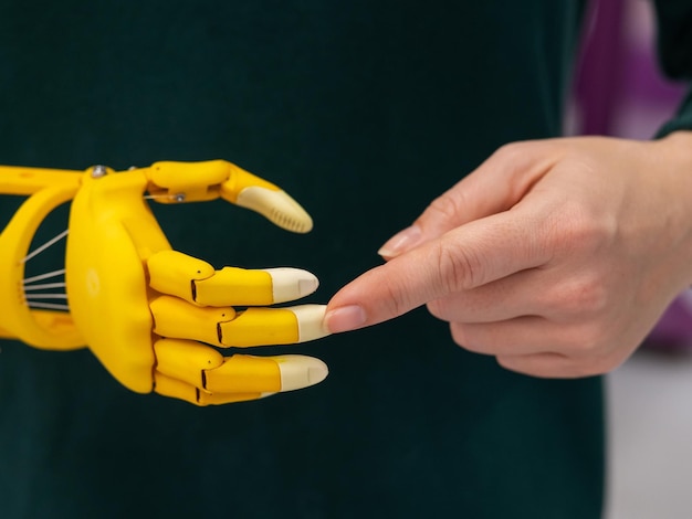 Midsection of man holding yellow flower