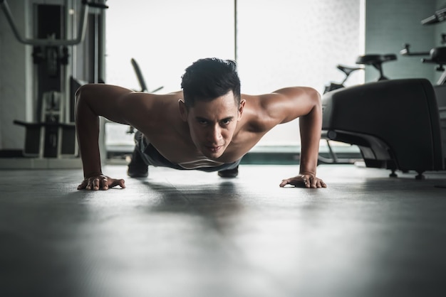 Photo midsection of man making face on floor