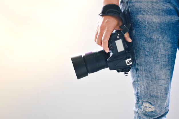 Photo midsection of man photographing against white background