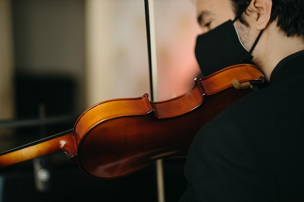 midsection of man playing guitar