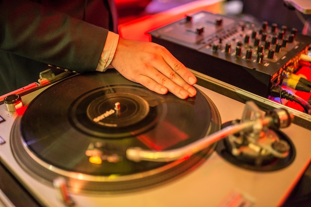 Photo midsection of man playing records