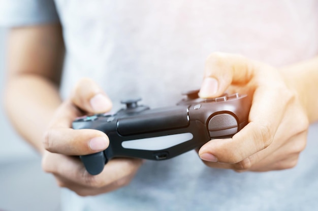 Photo midsection of man playing video game