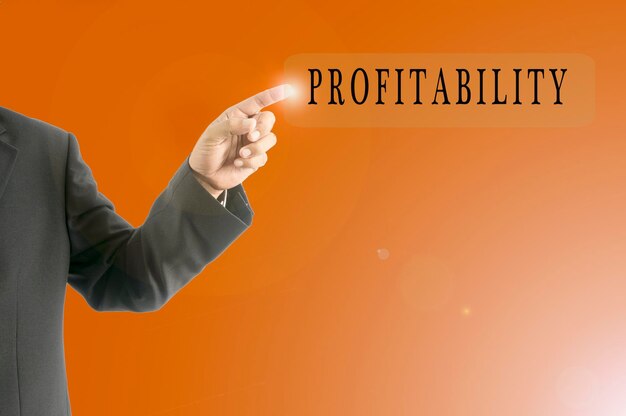 Midsection of man pointing towards profitability message against orange background
