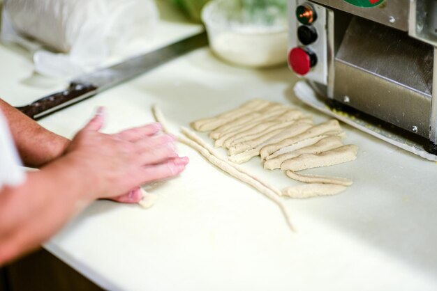 Midsection of man preparing food in kitchen