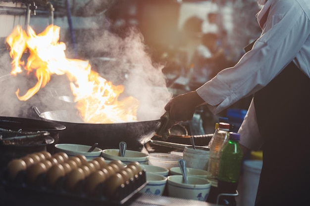 midsection of man preparing food at night