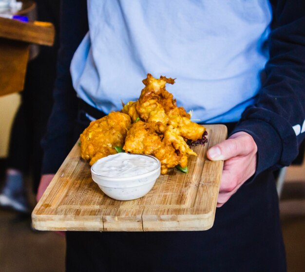 Midsection of man preparing food on table