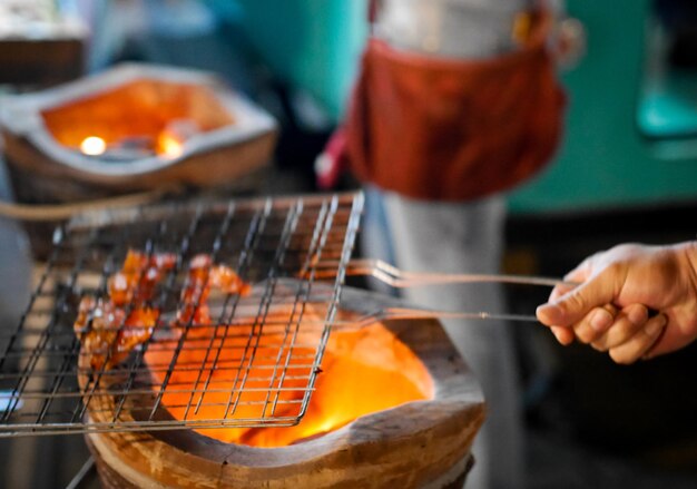 Midsection of man preparing food