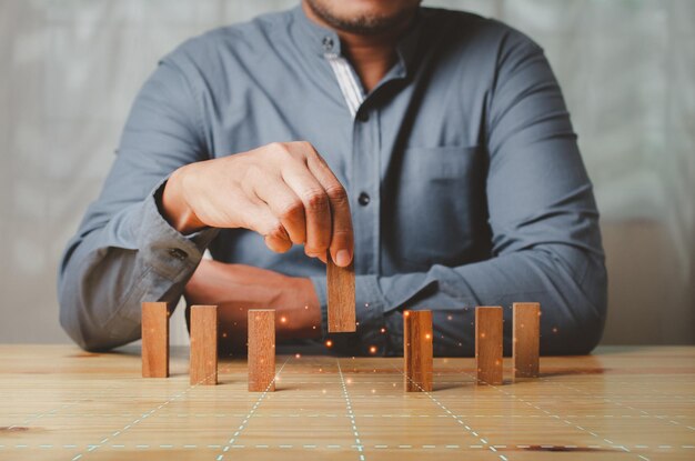 Photo midsection of man sitting on table