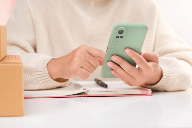 Midsection of man using calculator while sitting on table