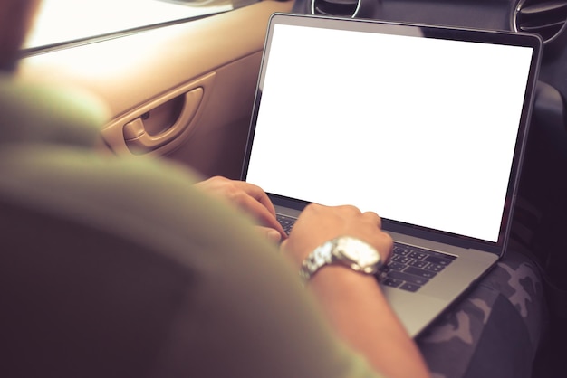 Photo midsection of man using laptop in car