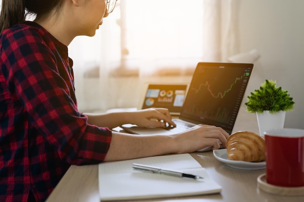 midsection of man using laptop on table