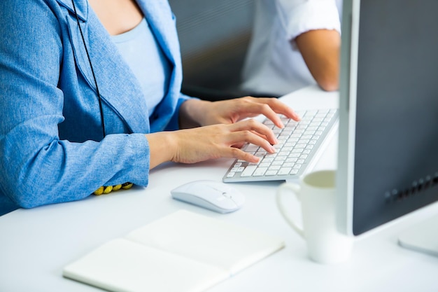 midsection of man using laptop on table