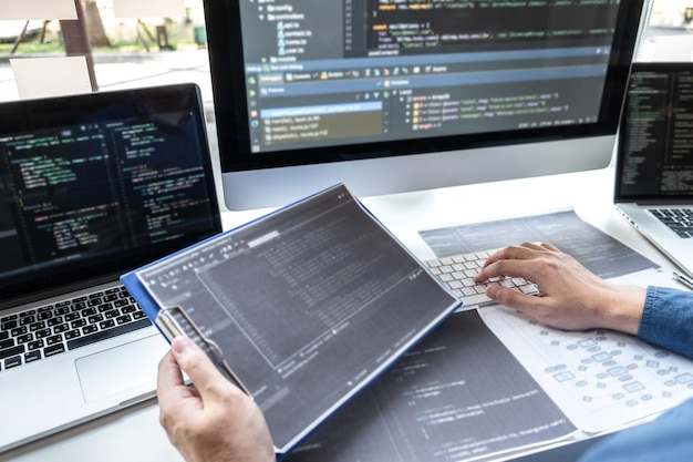 Midsection of man using laptop on table