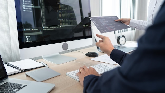 Midsection of man using laptop on table