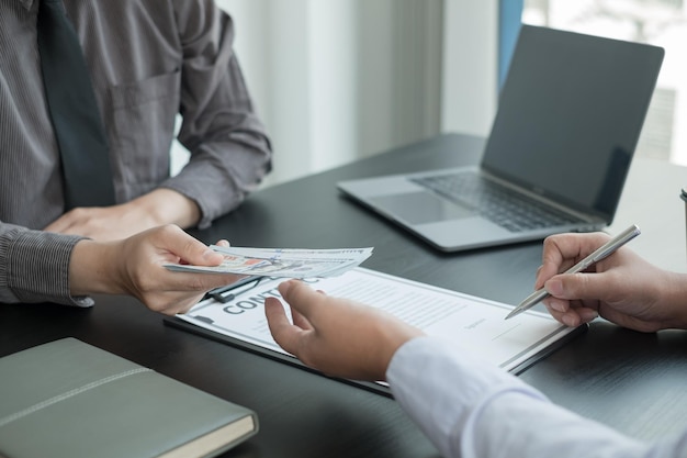 Midsection of man using laptop on table