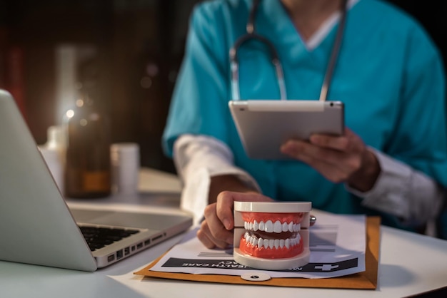 Photo midsection of man using laptop on table