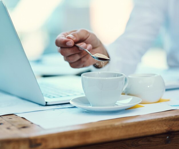 Photo midsection of man using laptop on table