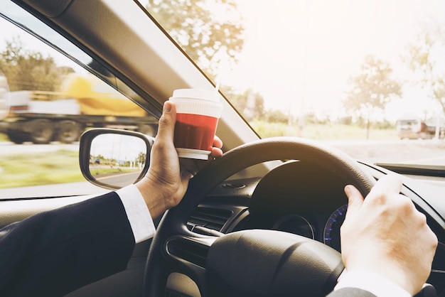 Photo midsection of man using mobile phone in car