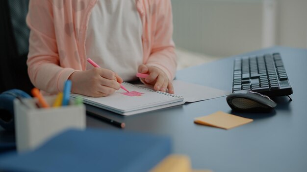 Midsection of man using mobile phone on table