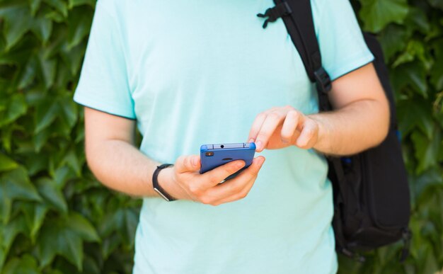 Photo midsection of man using mobile phone