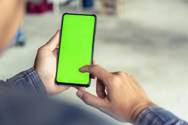 midsection of man using mobile phone