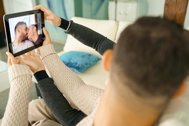 Midsection of man using mobile phone