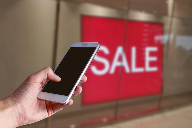 Photo midsection of man using mobile phone