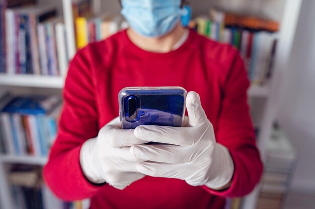 Midsection of man using mobile phone