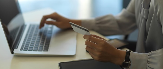 Midsection of man using mobile phone