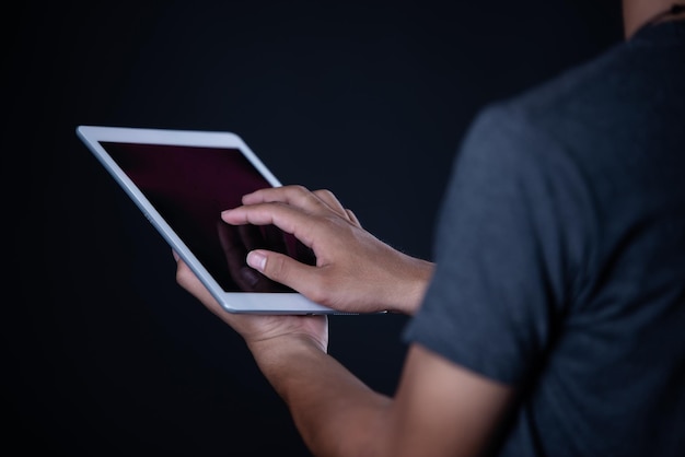 Photo midsection of man using mobile phone