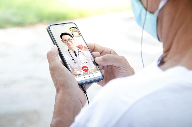 Photo midsection of man using mobile phone