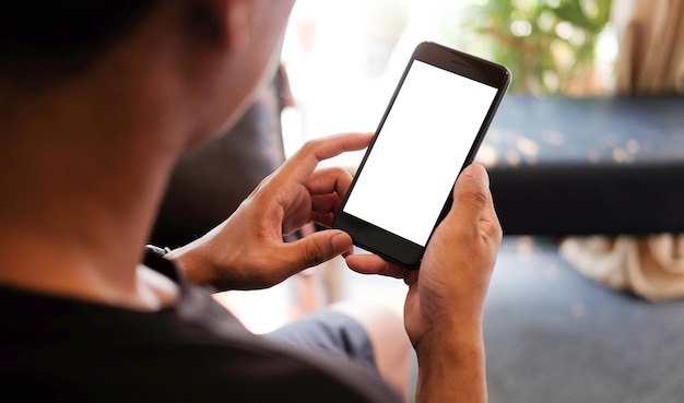 midsection of man using mobile phone