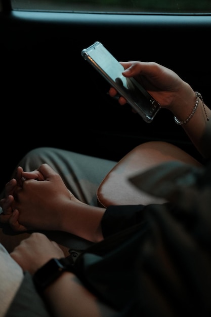 midsection of man using mobile phone