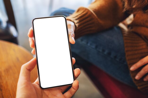 Midsection of man using mobile phone