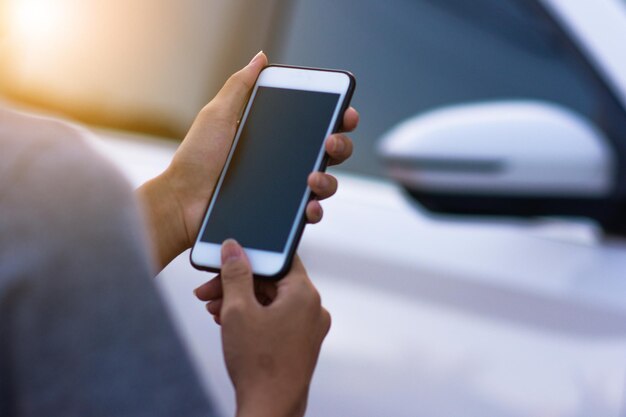 Photo midsection of man using mobile phone