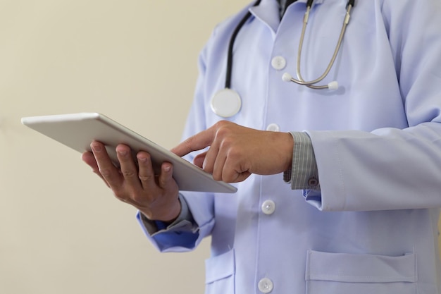 Midsection of man using mobile phone