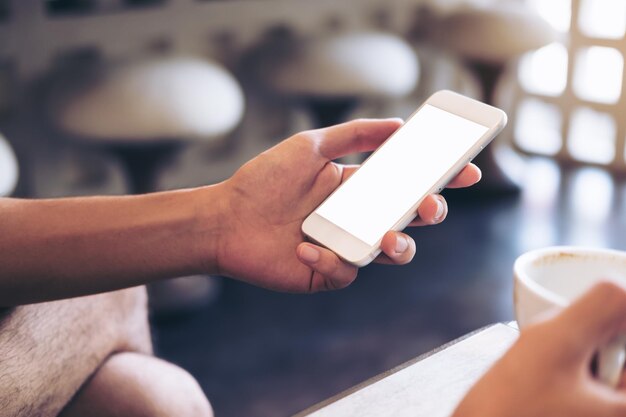 Photo midsection of man using mobile phone