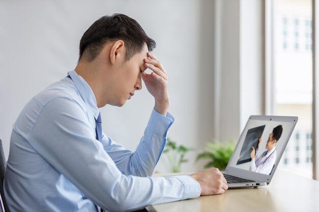 Midsection of man using mobile phone