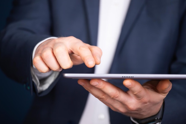 midsection of man using mobile phone