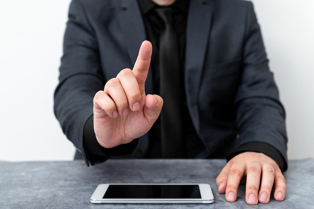 Photo midsection of man using mobile phone