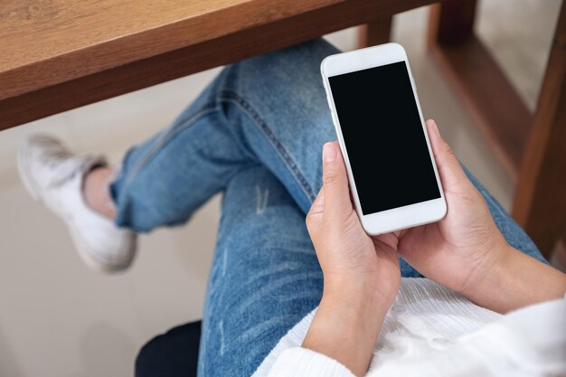 Photo midsection of man using mobile phone