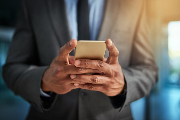 Photo midsection of man using mobile phone