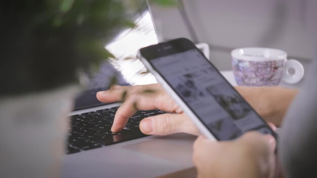 Photo midsection of man using mobile phone