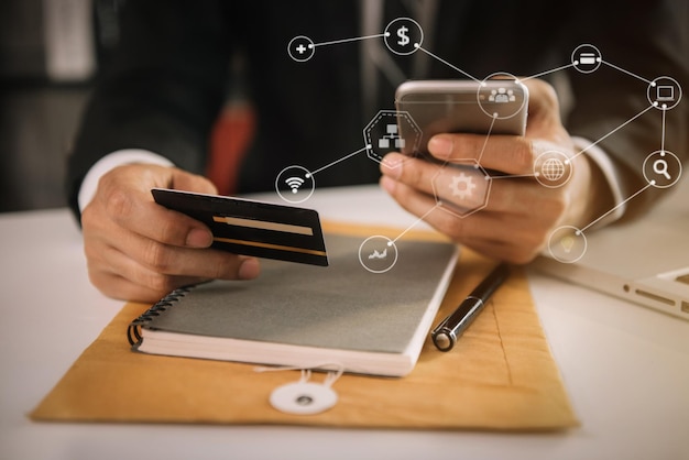 Photo midsection of man using smart phone on table