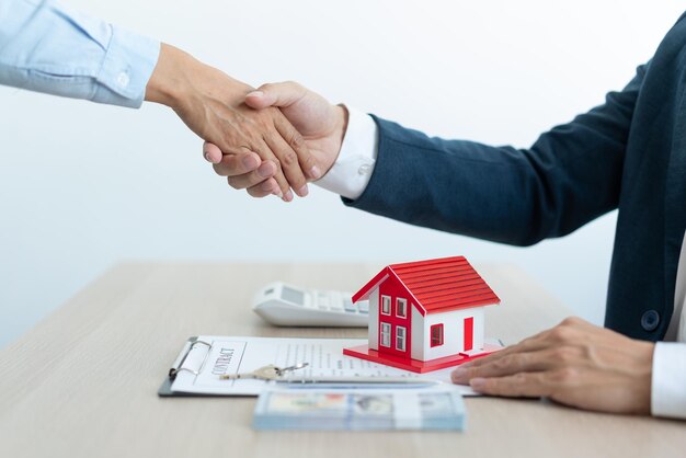 Midsection of man and woman on table by house