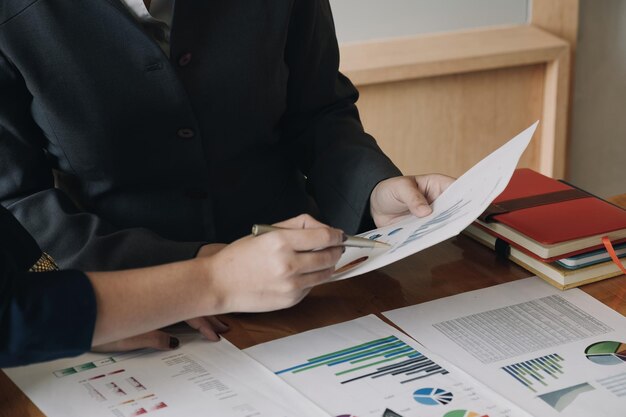 Midsection of man working on book